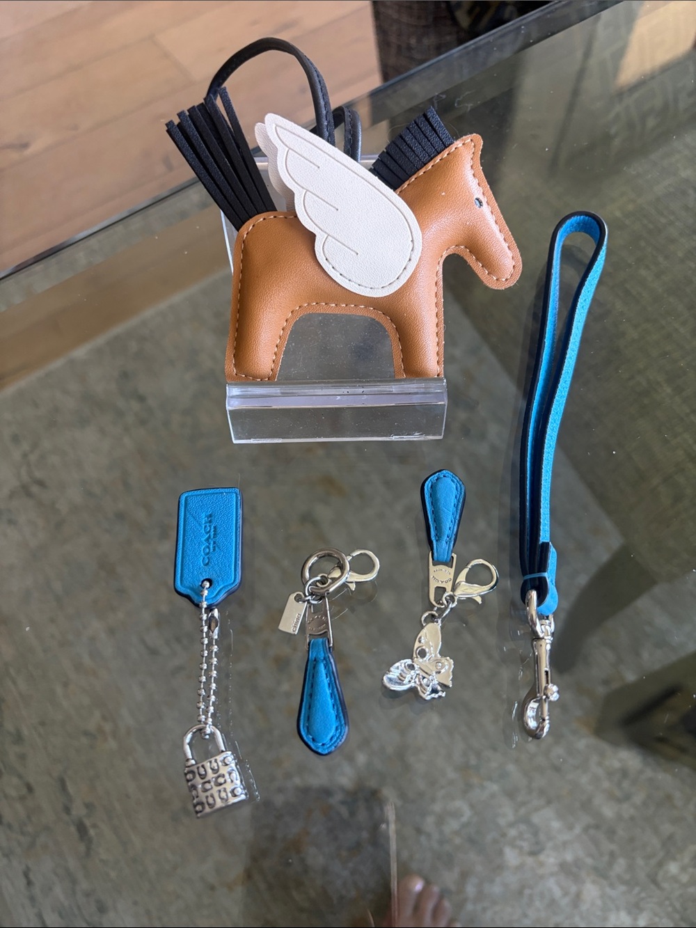 Coach blue leather / silver 4 Charm/ wrist strap with pony charm